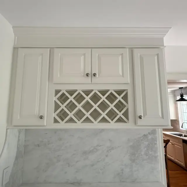 Built-in bar cabinetry with lattice wine rack in Sherborn, MA