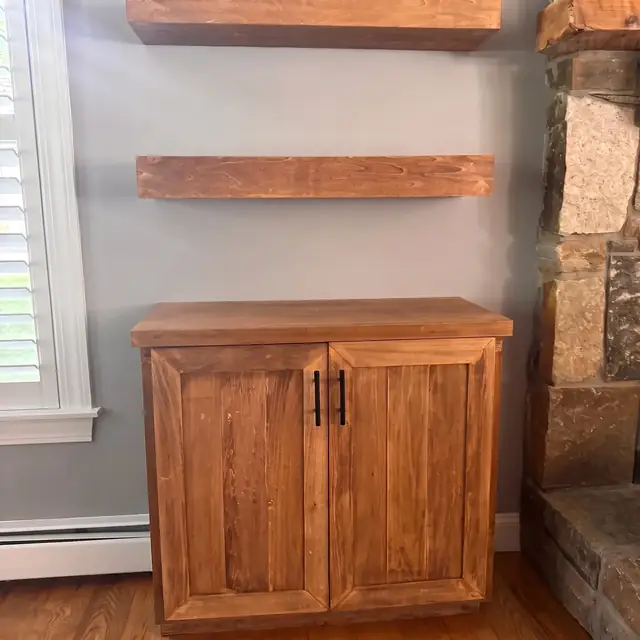 Custom wood cabinet with floating shelf above
