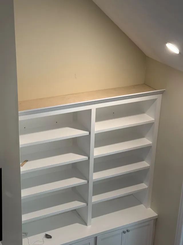 White built-in shelving over closed lower cabinets in North Andover, MA