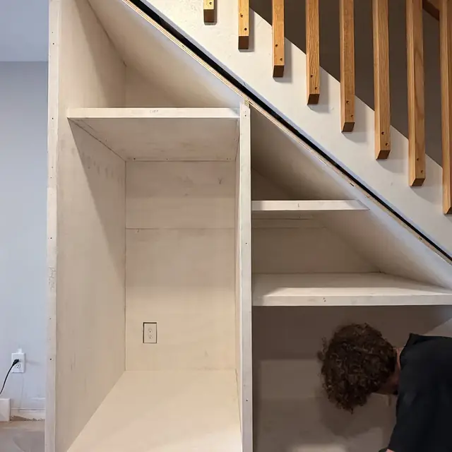 Under-stair built-in shelving during installation